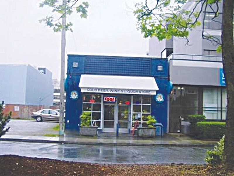 A blue building with a white awning on the front.